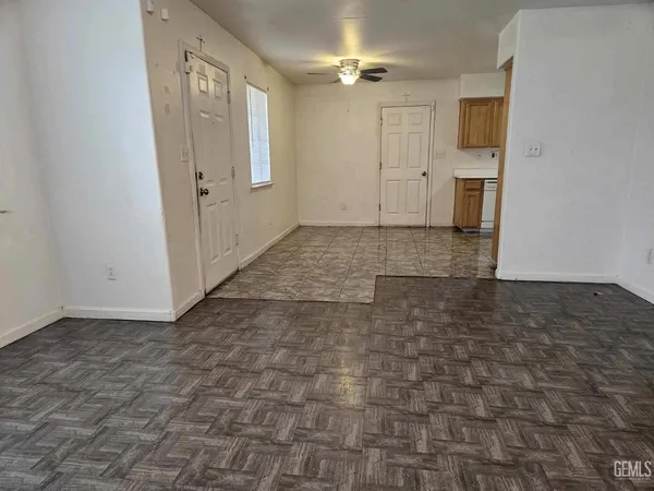 a view of a hallway with closet and wooden floor