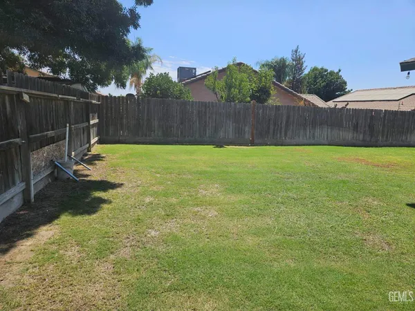 a view of a backyard with a slide