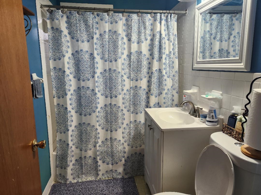 188 Ivan Road Memphis, TN 38109 - Photo 7 of 18 a bathroom with a sink and a mirror