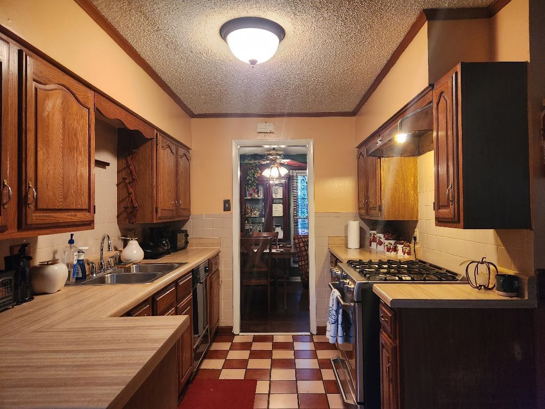188 Ivan Road Memphis, TN 38109 - Photo 8 of 18 a kitchen with a sink stove and refrigerator