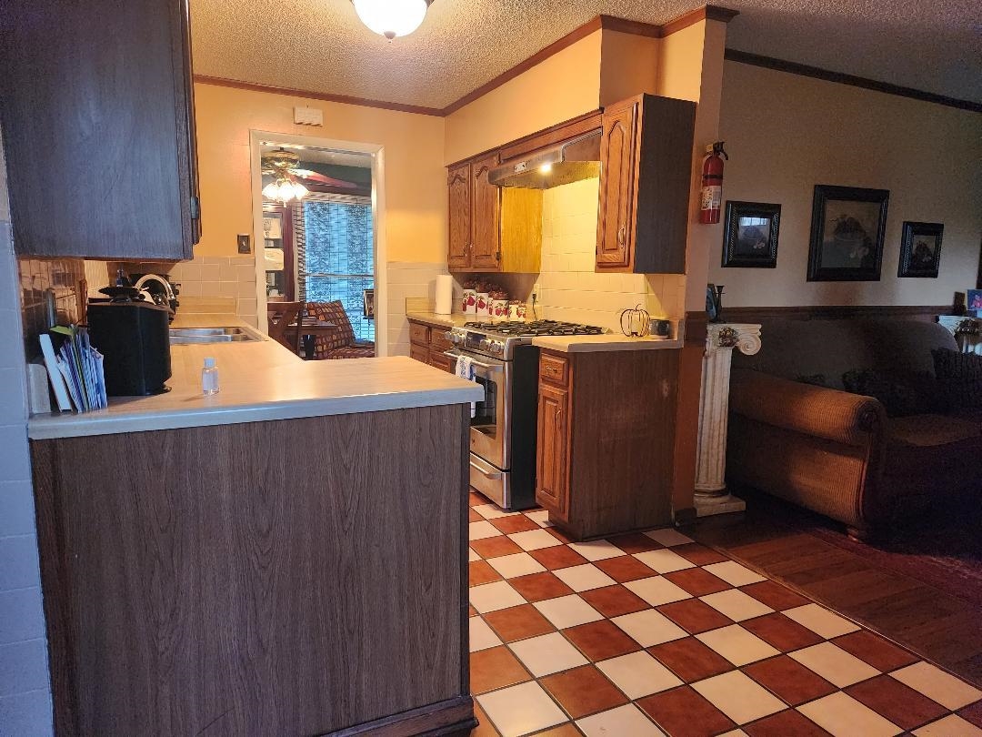 188 Ivan Road Memphis, TN 38109 - Photo 10 of 18 a living room with stainless steel appliances kitchen island granite countertop a refrigerator and a stove