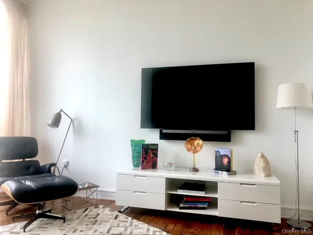 a room with furniture and a flat screen tv