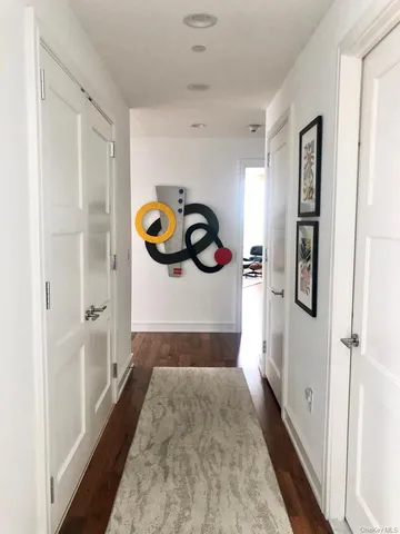 a bedroom with a bed and a mirror