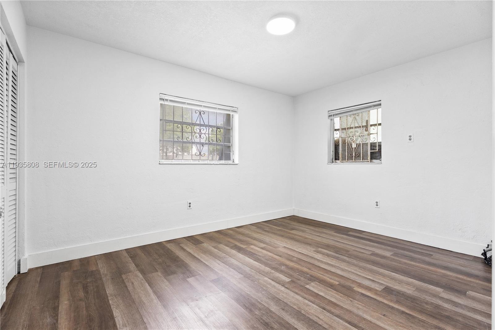 4201 Northwest 25th Avenue, Unit 2 Miami, FL 33142 - Photo 10 of 13 an empty room with a window