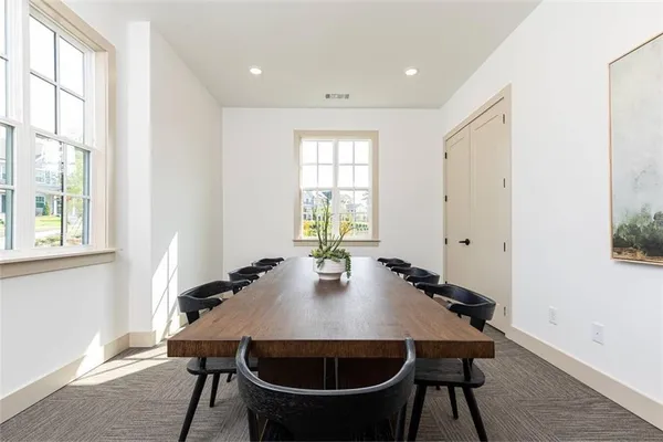 a view of a dining room with furniture and window
