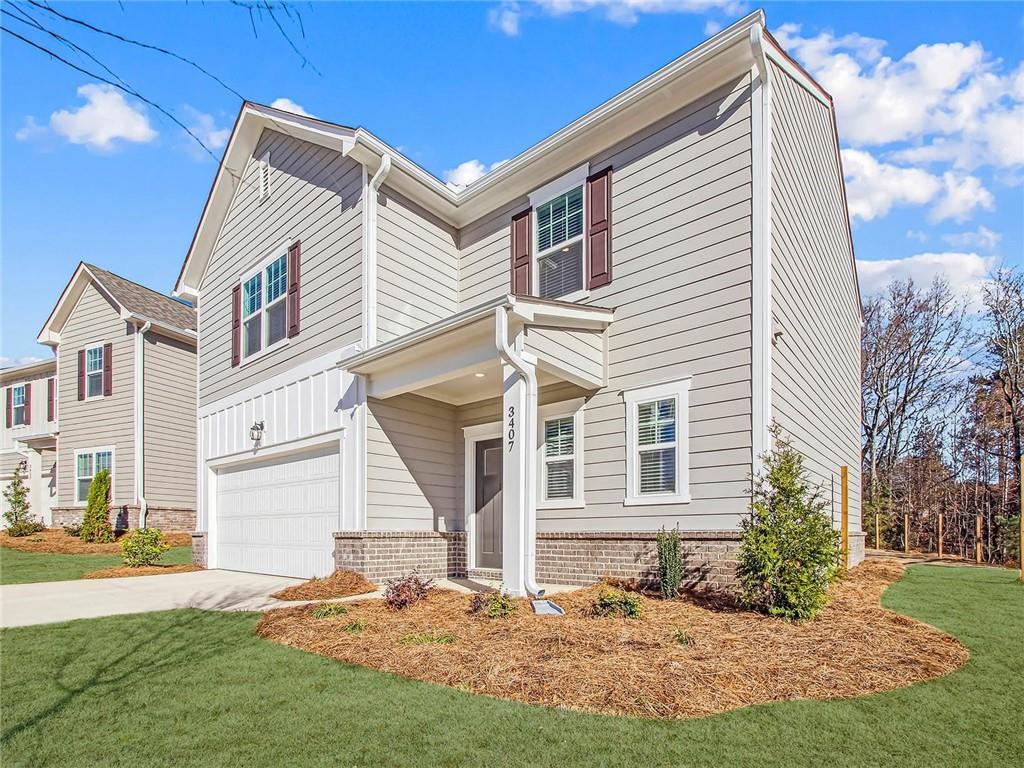 3373 Fence Road Northeast, Unit D2 Dacula, GA 30019 - Photo 22 of 36 a front view of a house with a yard