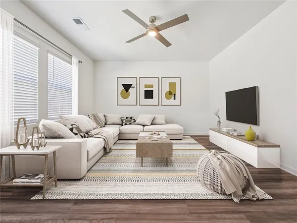 a living room with furniture and a flat screen tv
