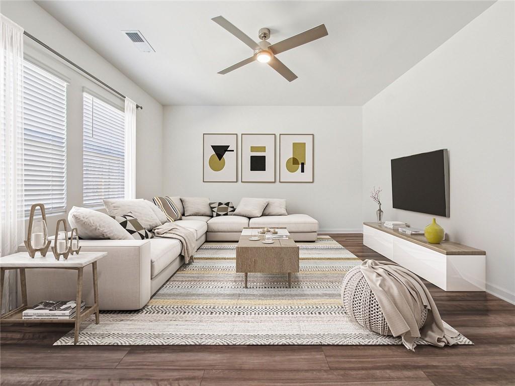 3373 Fence Road Northeast, Unit D2 Dacula, GA 30019 - Photo 26 of 36 a living room with furniture and a flat screen tv