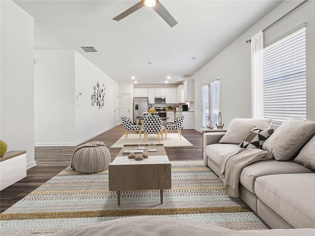 3373 Fence Road Northeast, Unit D2 Dacula, GA 30019 - Photo 27 of 36 a living room with furniture a couch and a window