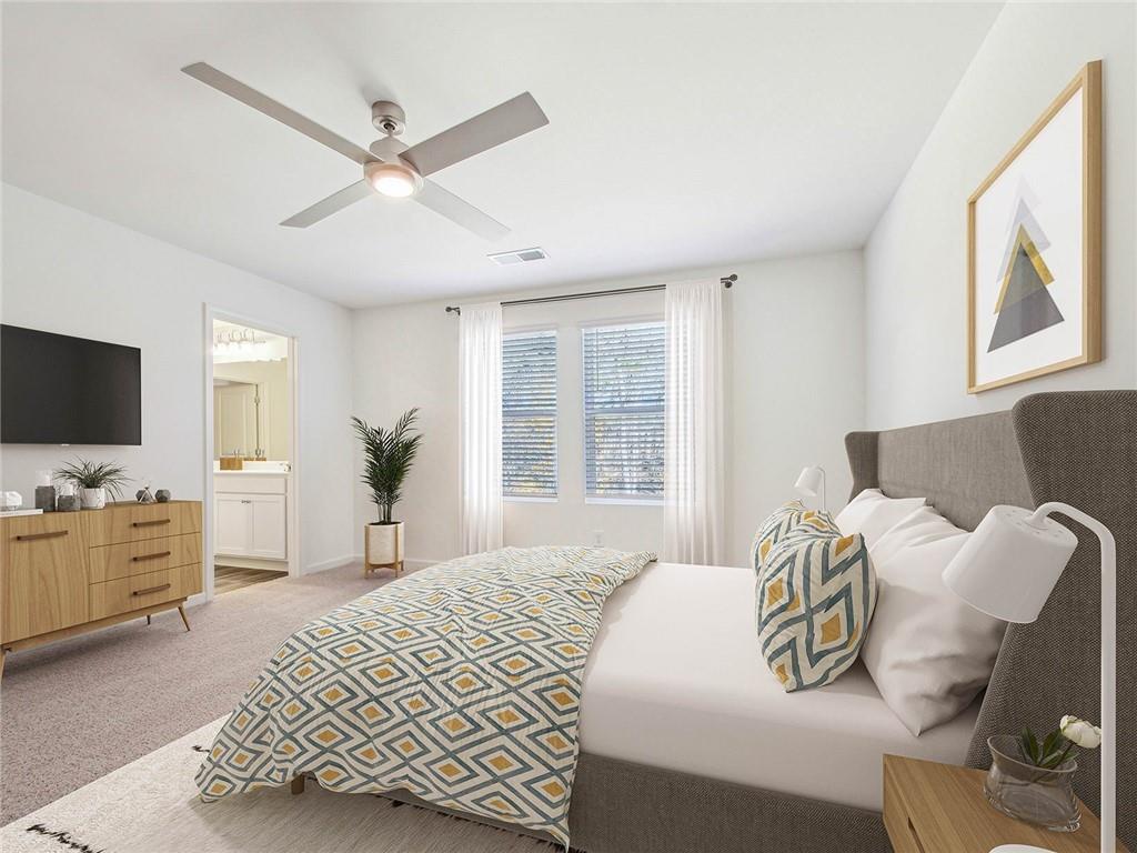 3373 Fence Road Northeast, Unit D2 Dacula, GA 30019 - Photo 29 of 36 a bedroom with a bed and a flat screen tv