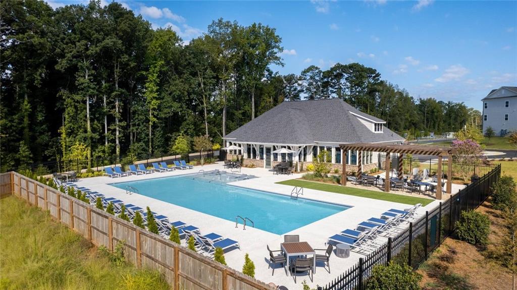 3373 Fence Road Northeast, Unit D2 Dacula, GA 30019 - Photo 3 of 36 a view of a house with swimming pool and sitting area