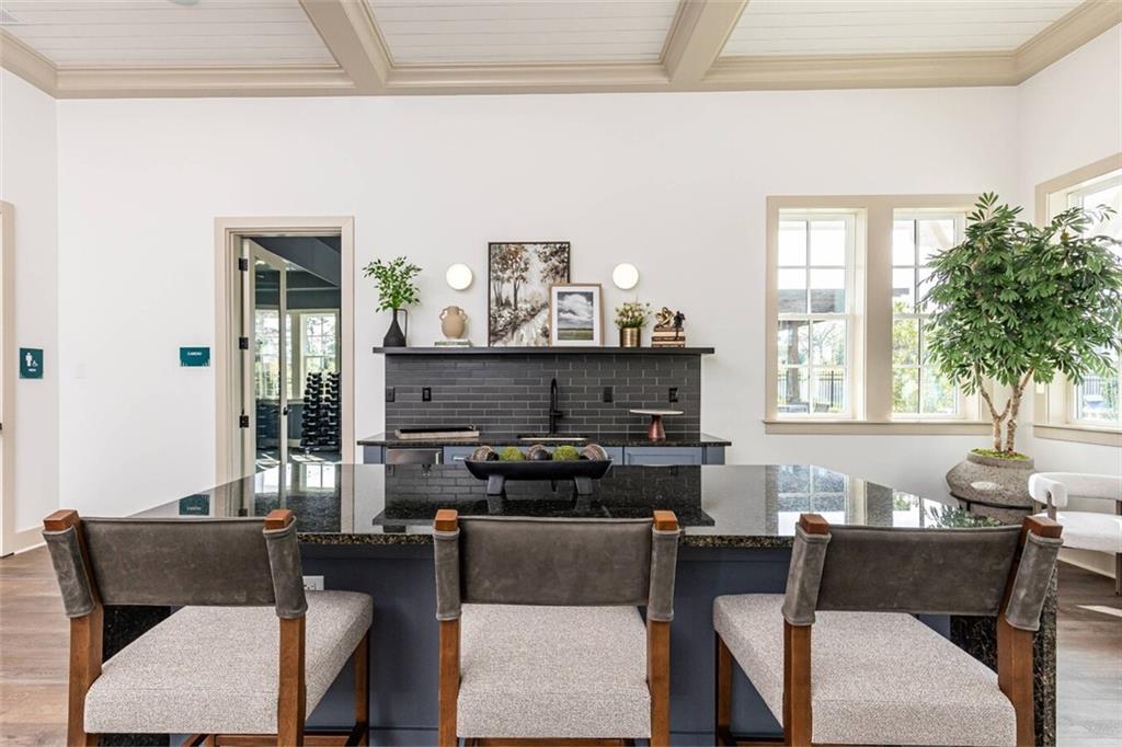 3373 Fence Road Northeast, Unit D2 Dacula, GA 30019 - Photo 8 of 36 a living room with furniture and a potted plant