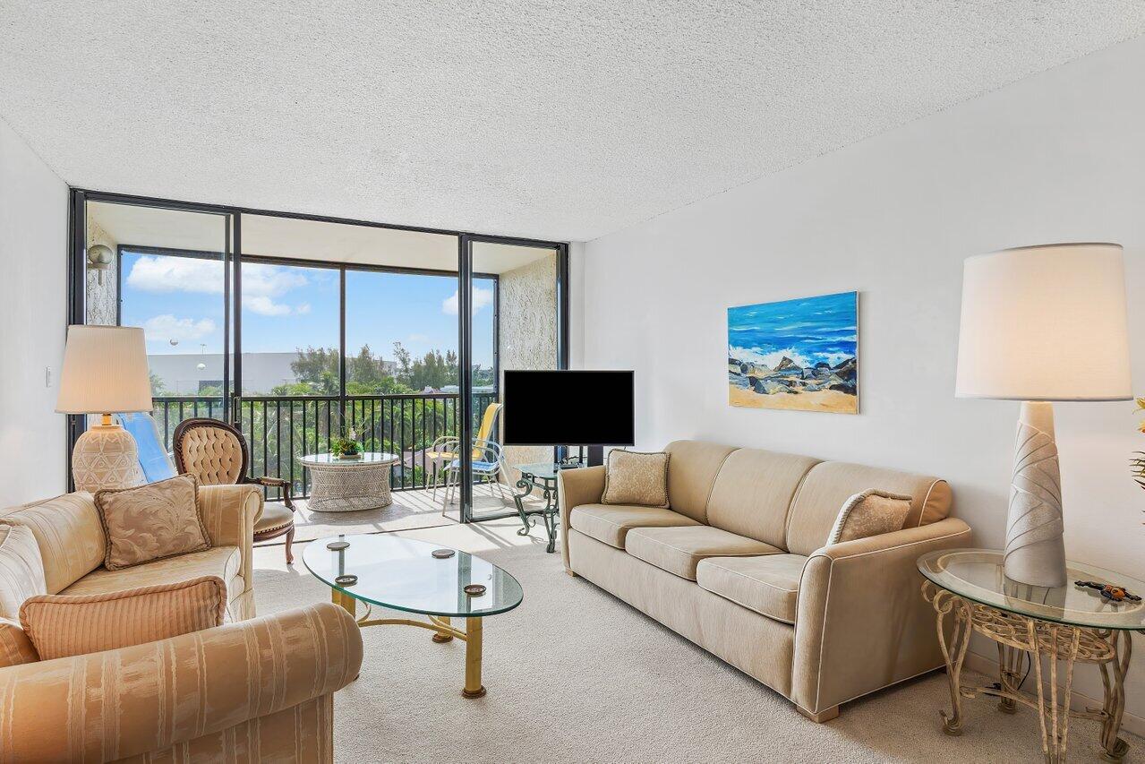 13 Royal Palm Way, Unit 602 Boca Raton, FL 33432 - Photo 12 of 41 a living room with furniture and a large window
