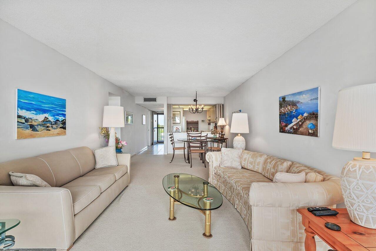 13 Royal Palm Way, Unit 602 Boca Raton, FL 33432 - Photo 13 of 41 a living room with furniture and a view of kitchen