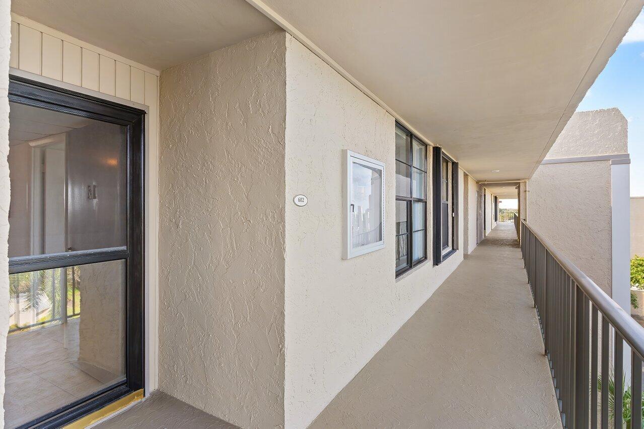 13 Royal Palm Way, Unit 602 Boca Raton, FL 33432 - Photo 29 of 41 a view of a hallway with windows
