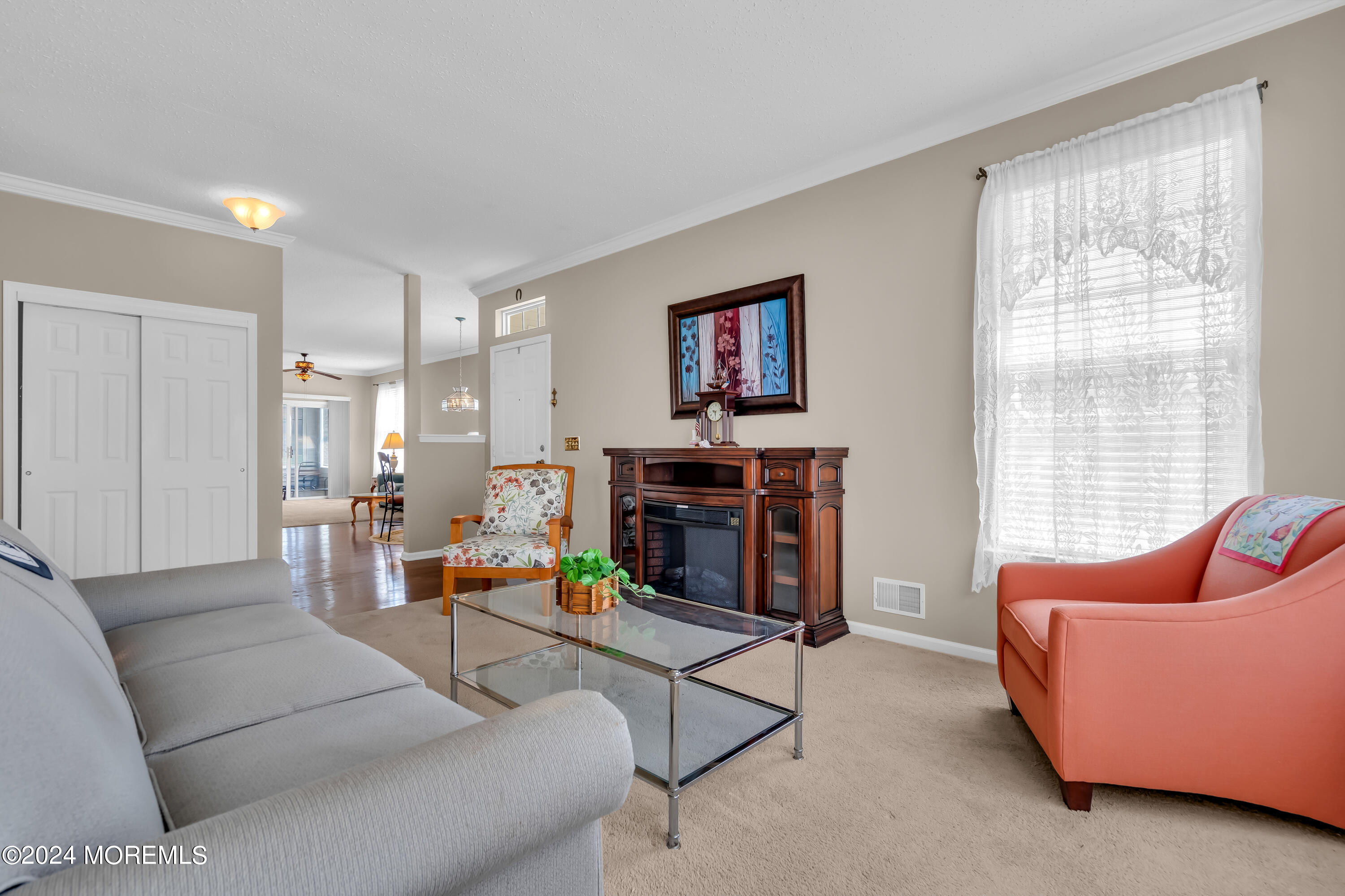 89 Quail Road Barnegat, NJ 08005 - Photo 20 of 37 a living room with furniture and a flat screen tv