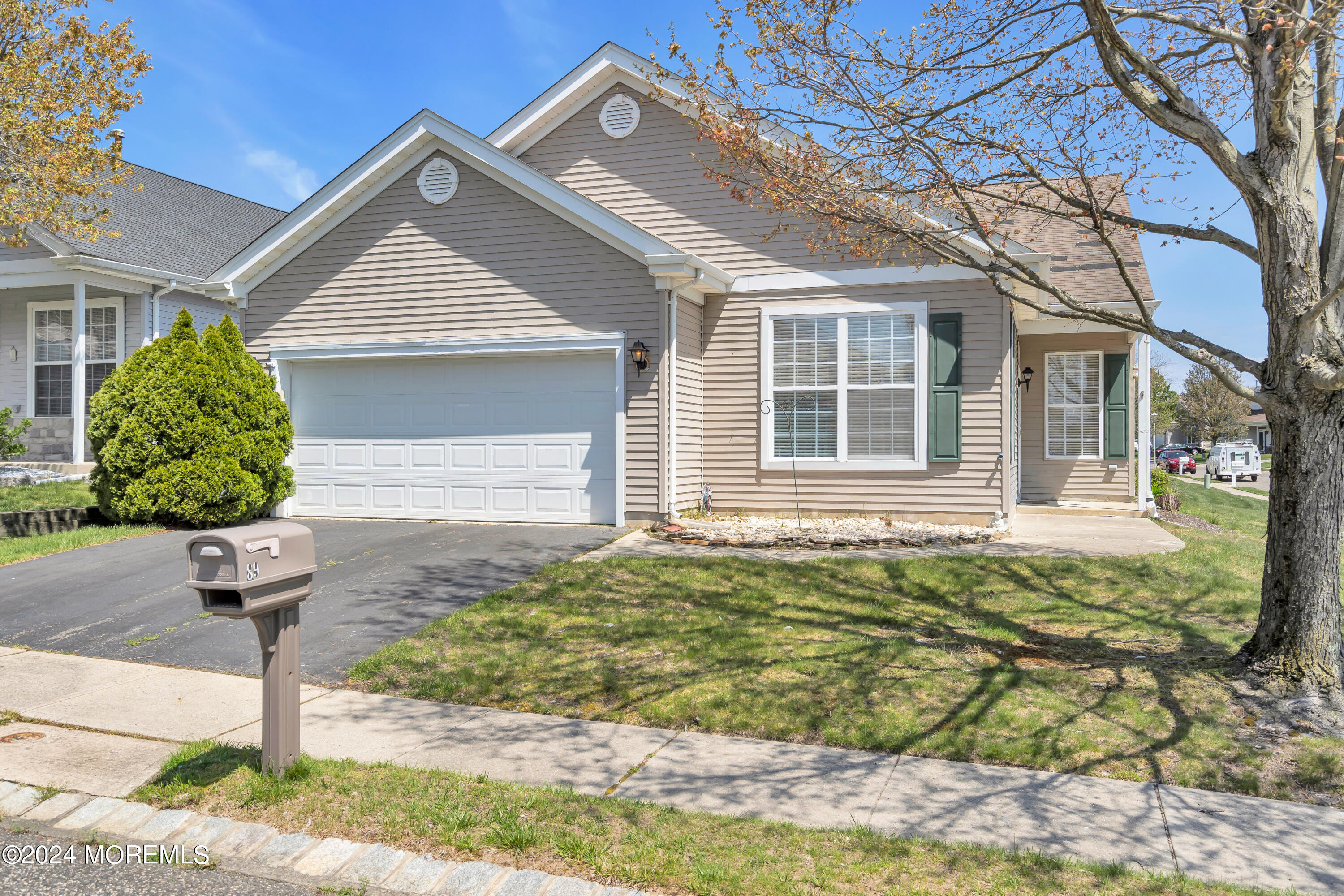 89 Quail Road Barnegat, NJ 08005 - Photo 3 of 37 a front view of a house with garden