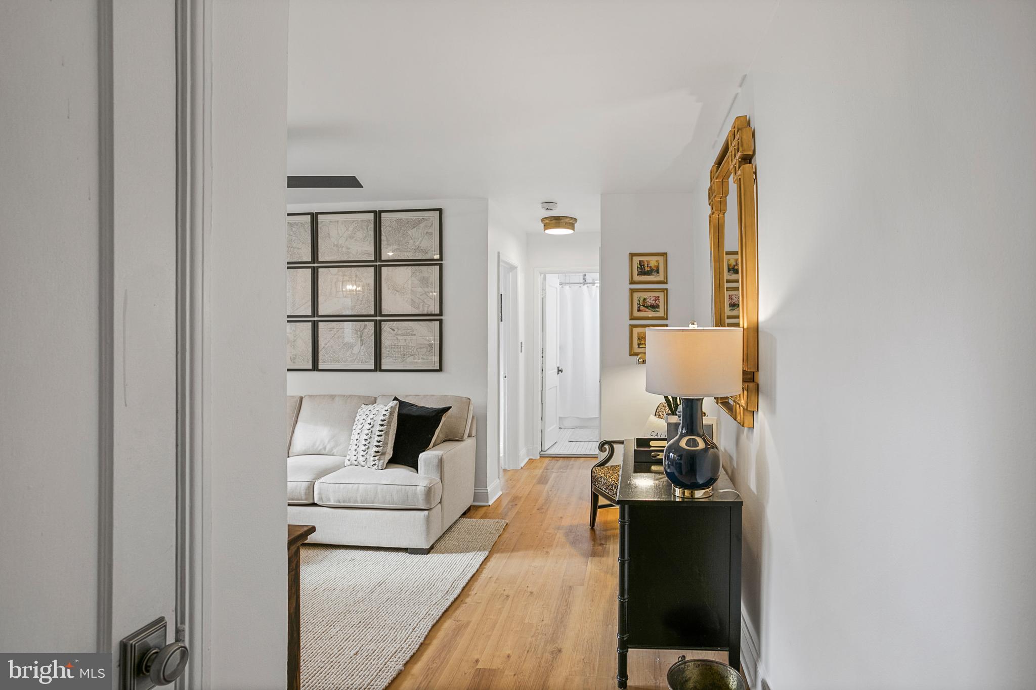 4029 Benton Street Northwest, Unit 101 Washington, DC 20007 - Photo 2 of 28 Living Room with brand new flooring throughout