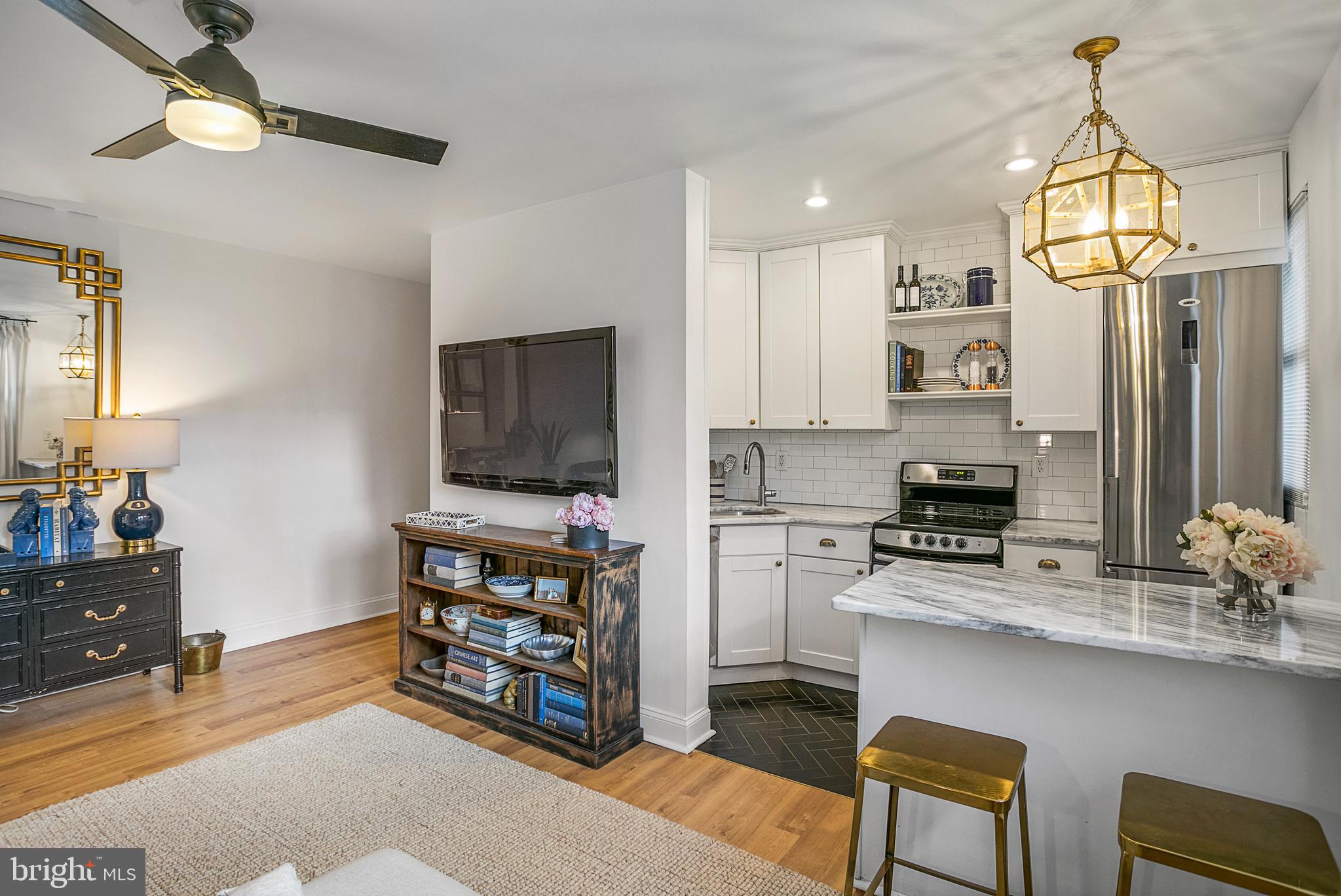 4029 Benton Street Northwest, Unit 101 Washington, DC 20007 - Photo 5 of 28 Kitchen with Breakfast Bar