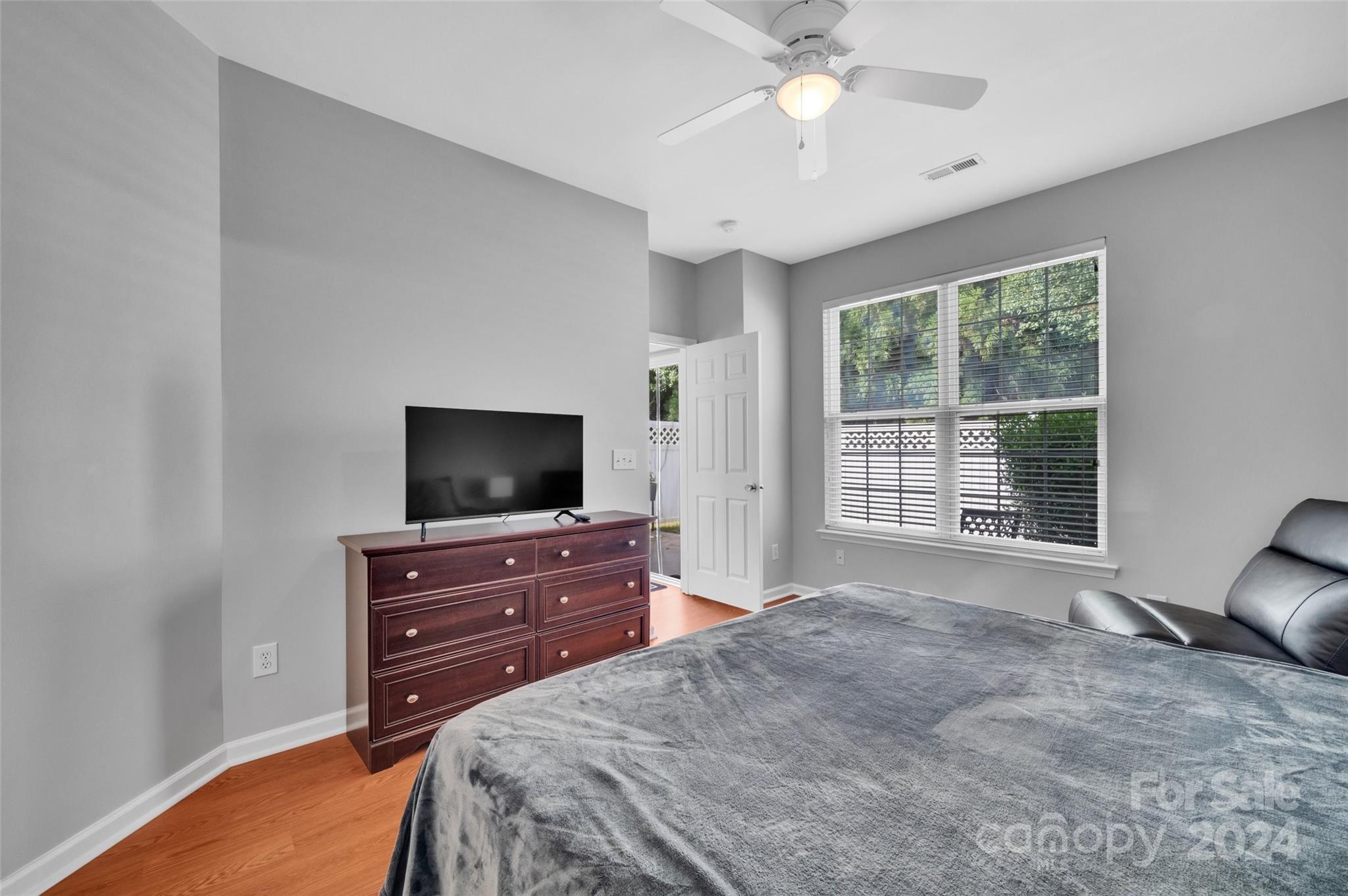 714 Shellstone Place Fort Mill, SC 29708 - Photo 12 of 24 a bedroom with a bed and a flat screen tv