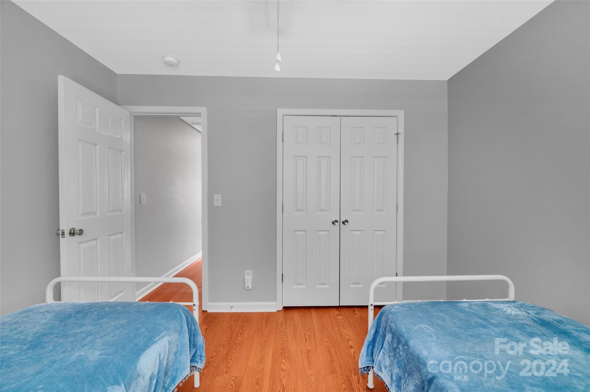 714 Shellstone Place Fort Mill, SC 29708 - Photo 17 of 24 a bedroom with a bed and wooden floor