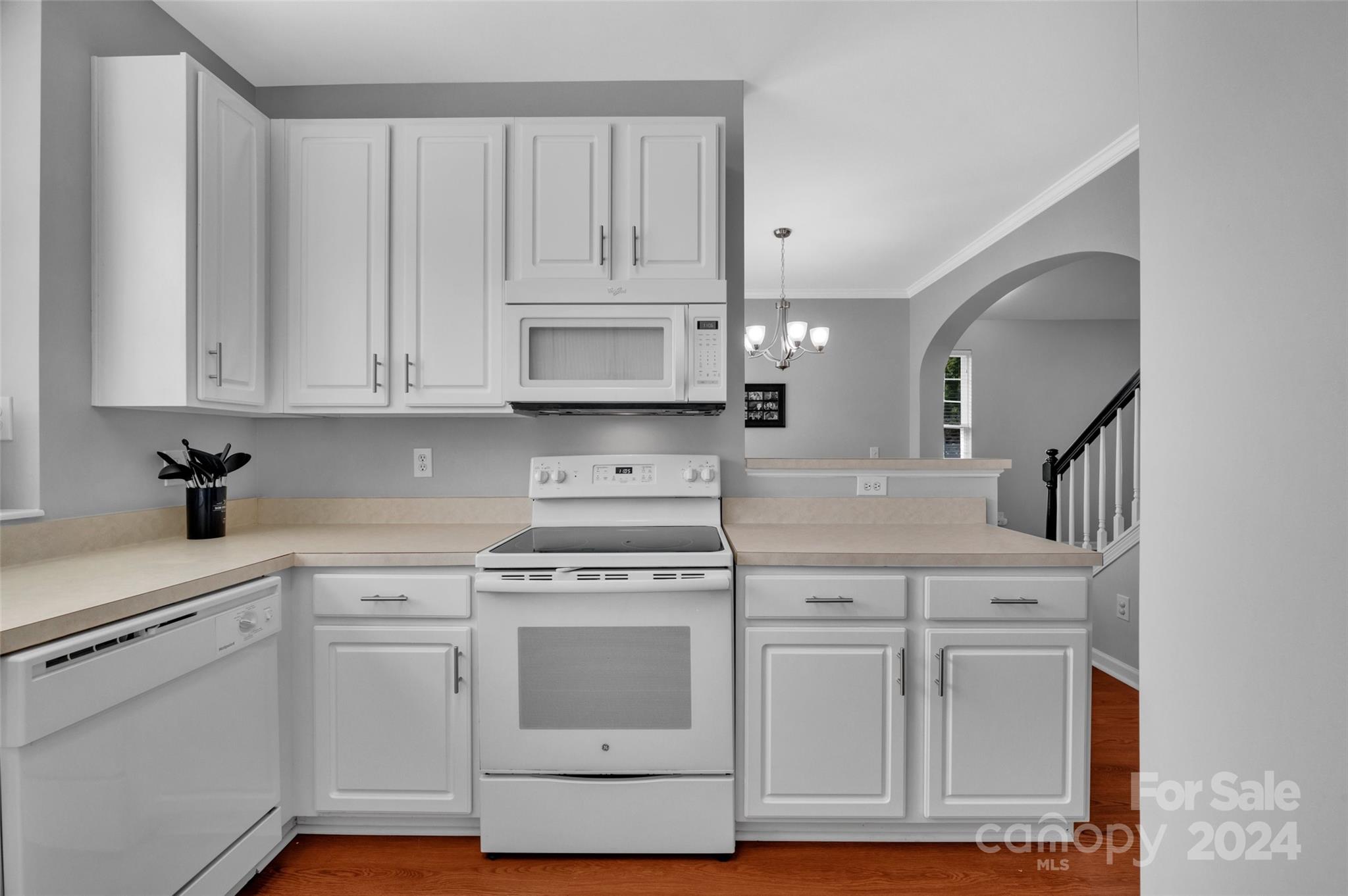 714 Shellstone Place Fort Mill, SC 29708 - Photo 7 of 24 a kitchen with white cabinets and white appliances