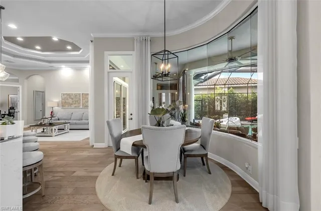 a view of a dining room with furniture and wooden floor