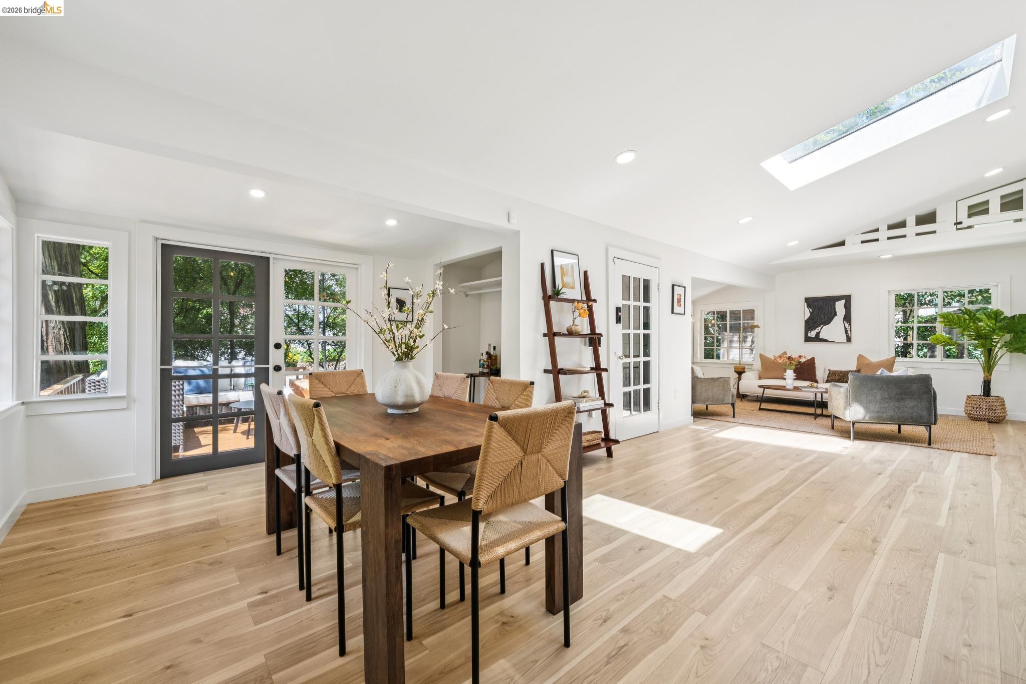 6400 Pinehaven Road Oakland, CA 94611 - Photo 19 of 78 Open-concept living space featuring light wood-finish flooring, white walls, and recessed lighting