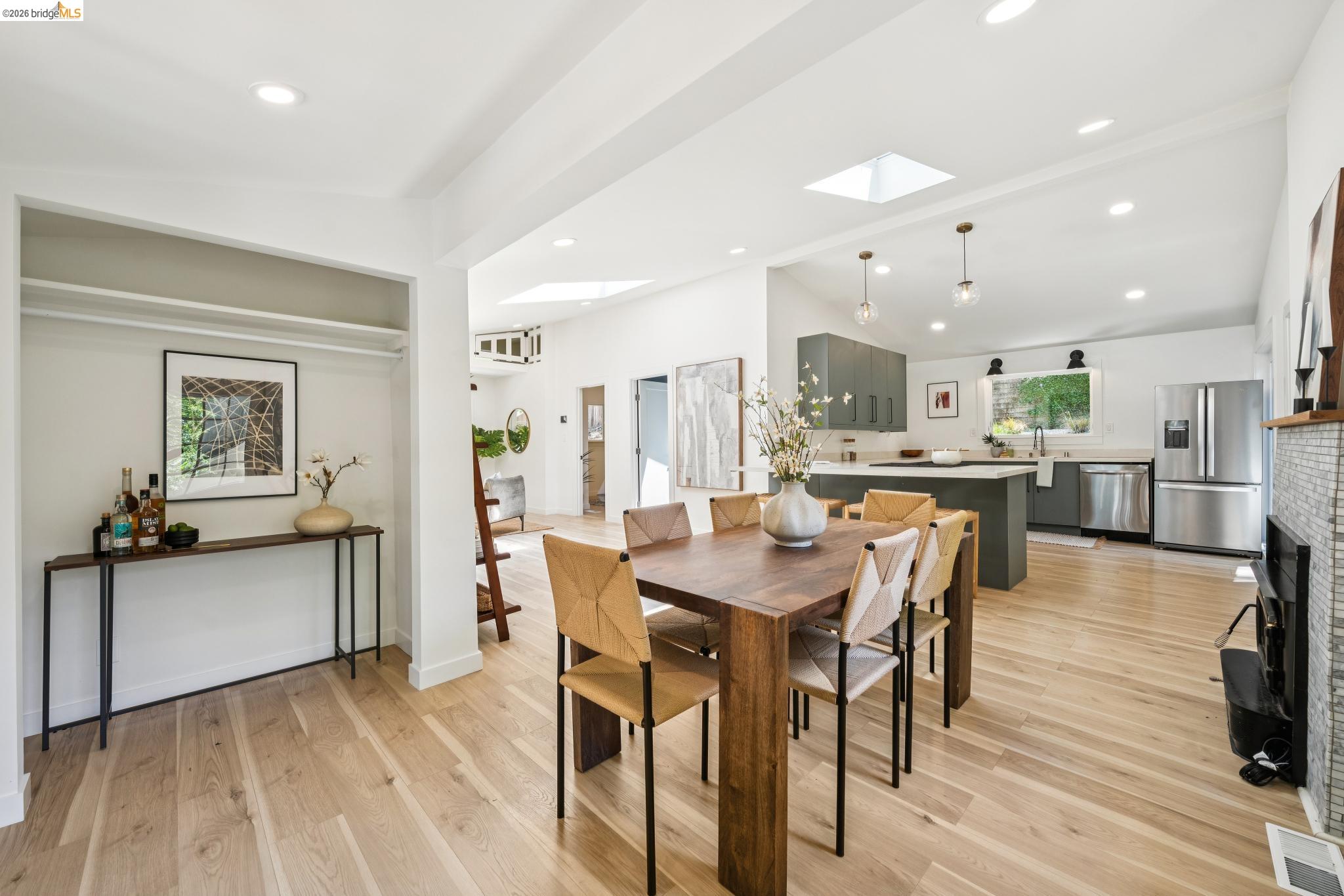 6400 Pinehaven Road Oakland, CA 94611 - Photo 20 of 78 Open-concept living area featuring light wood-finish flooring, recessed lighting, and a skylight