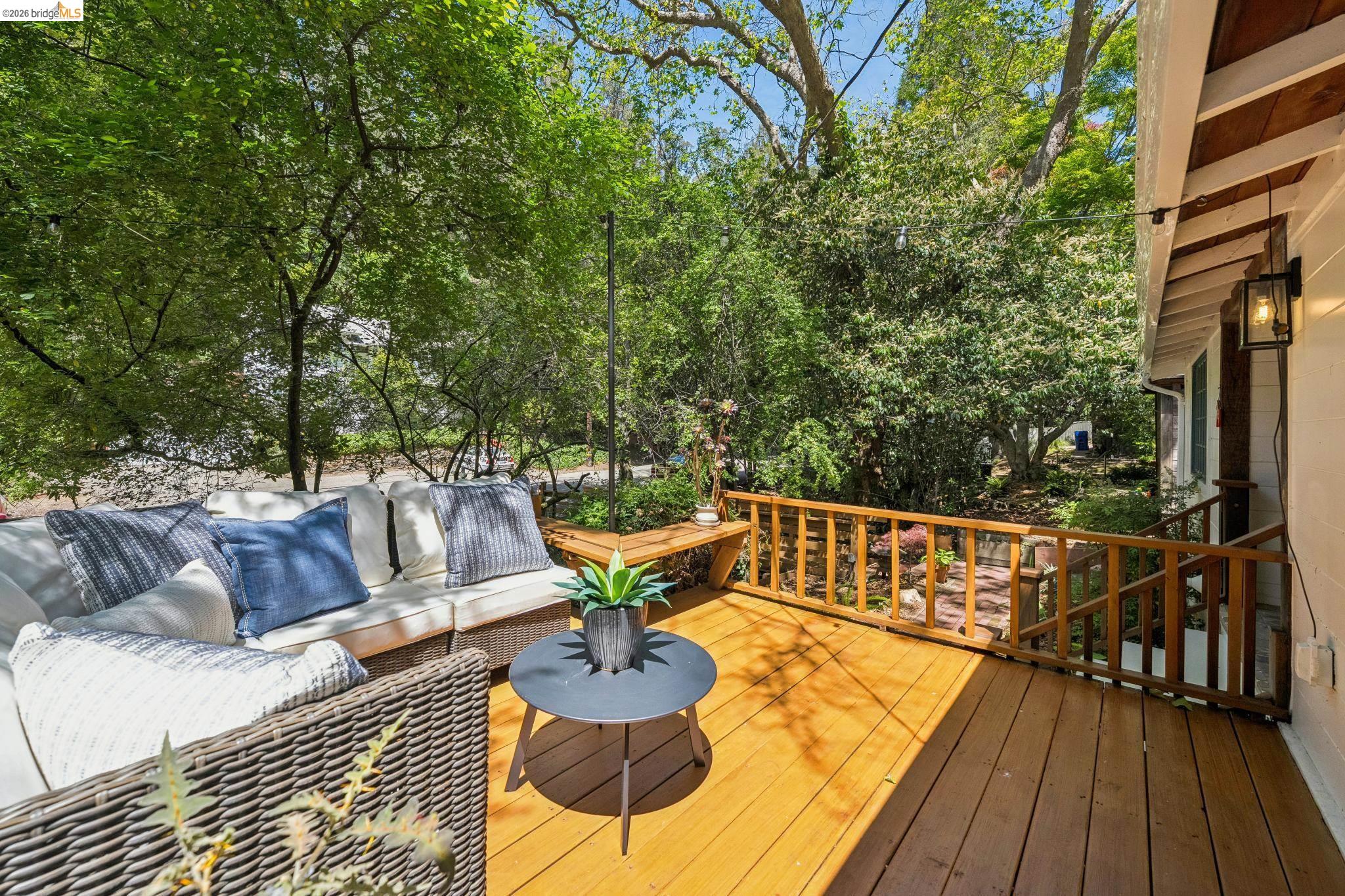 6400 Pinehaven Road Oakland, CA 94611 - Photo 33 of 78 Expansive wood-finish deck with natural wood railing and a built-in bench