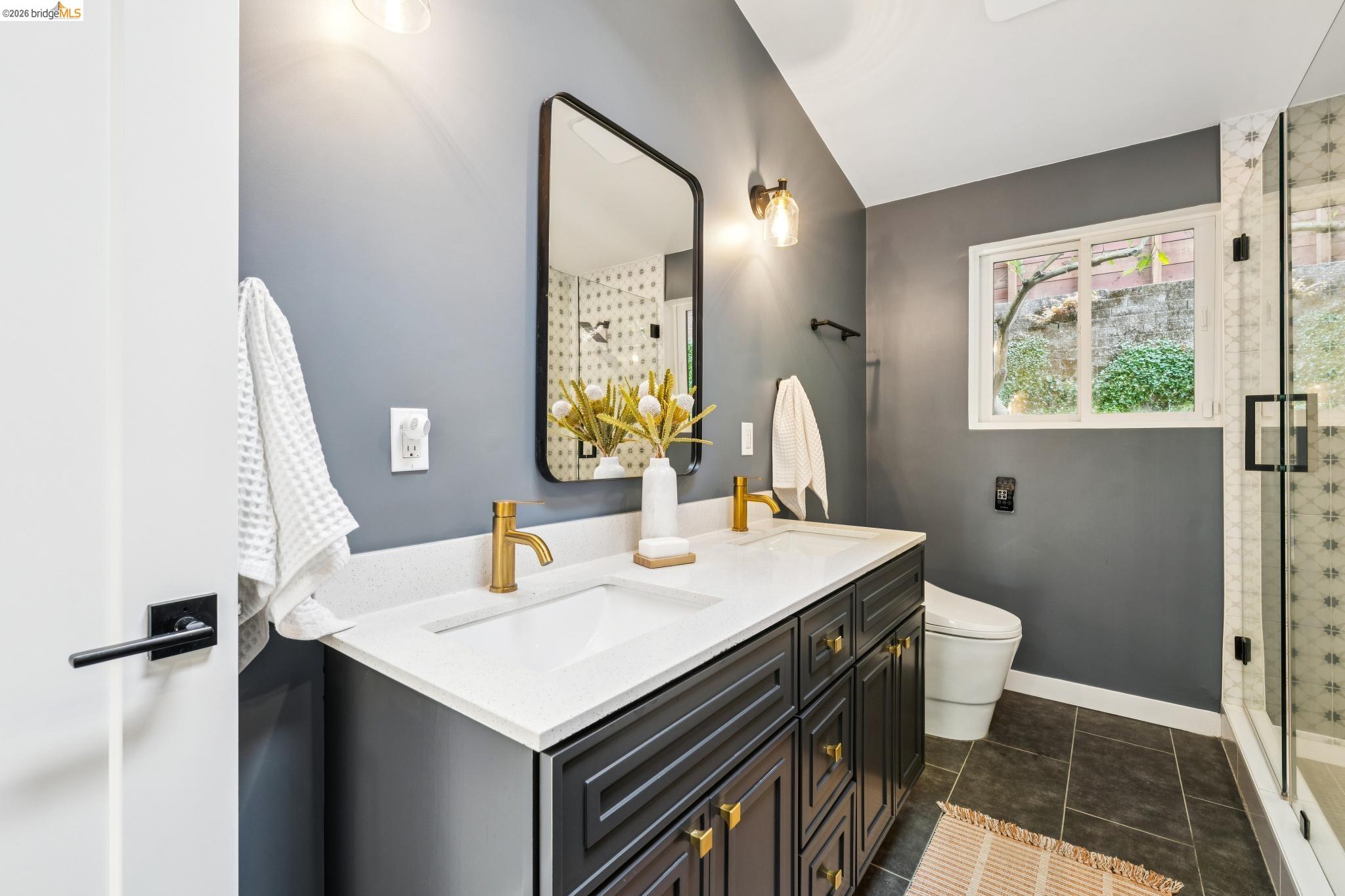 6400 Pinehaven Road Oakland, CA 94611 - Photo 41 of 78 Double vanity with quartz countertop and gold-finish fixtures