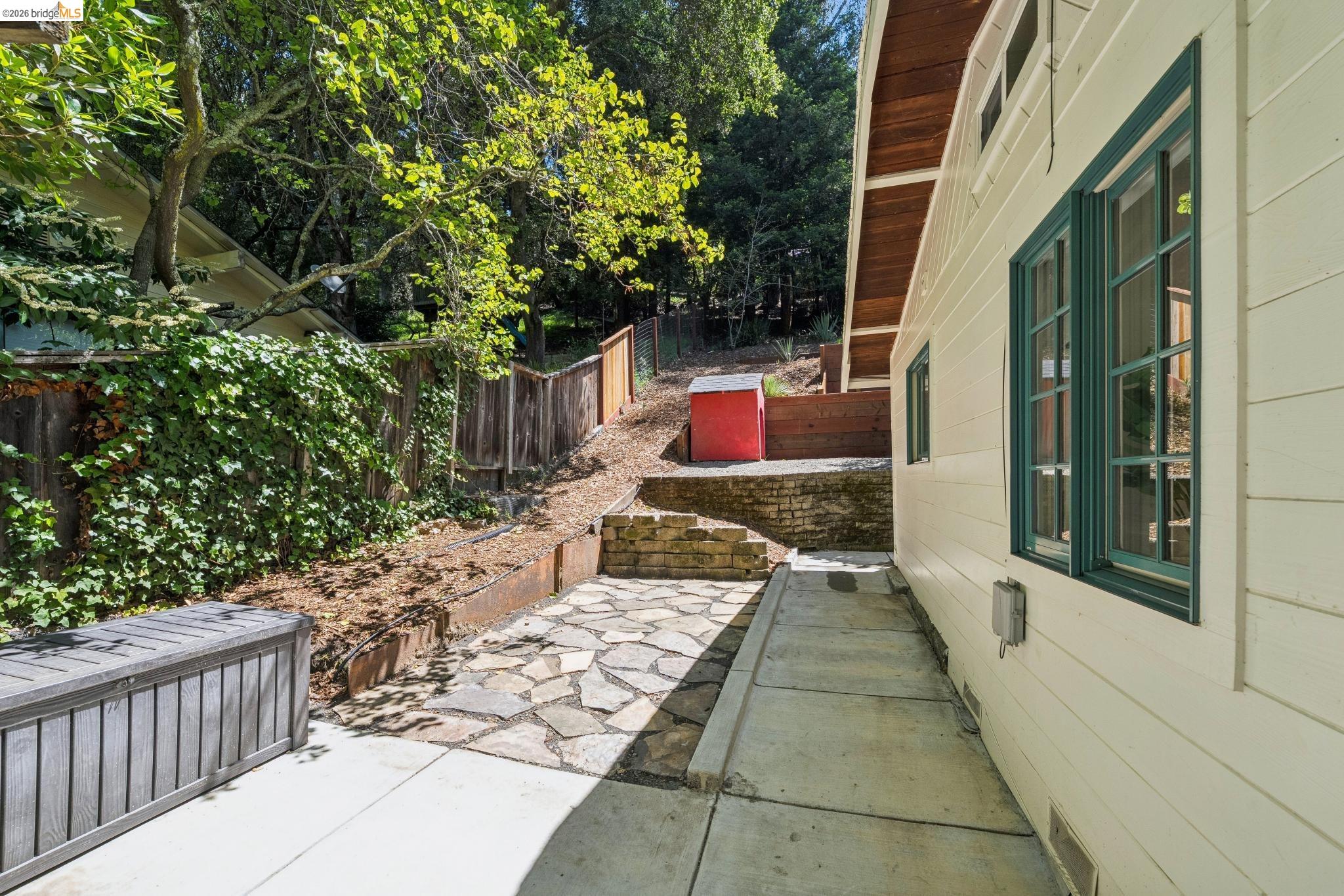 6400 Pinehaven Road Oakland, CA 94611 - Photo 66 of 78 Side yard featuring a stone patio area with a concrete pathway