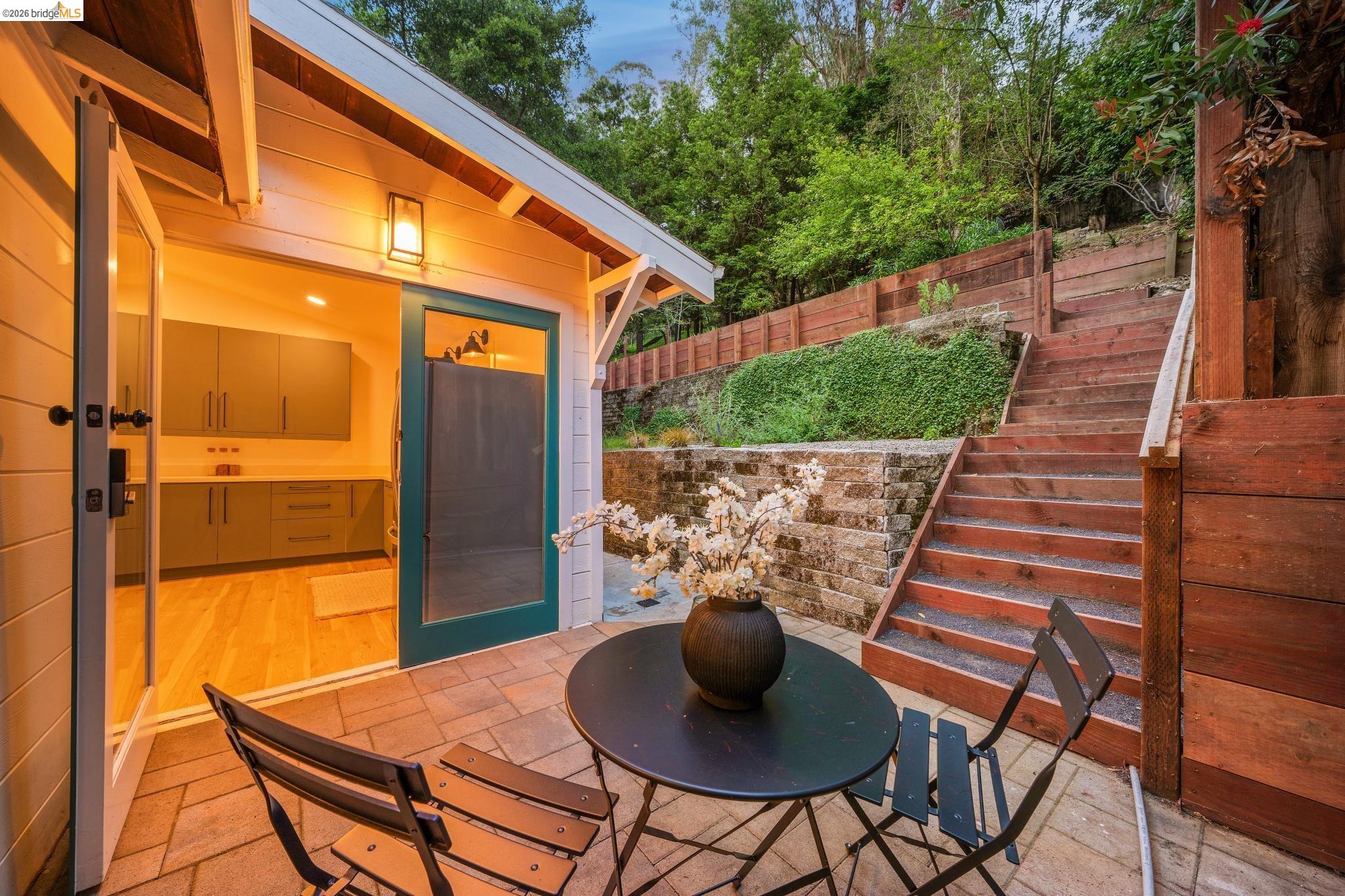 6400 Pinehaven Road Oakland, CA 94611 - Photo 71 of 78 Outdoor patio with paver flooring and wood-finish retaining walls
