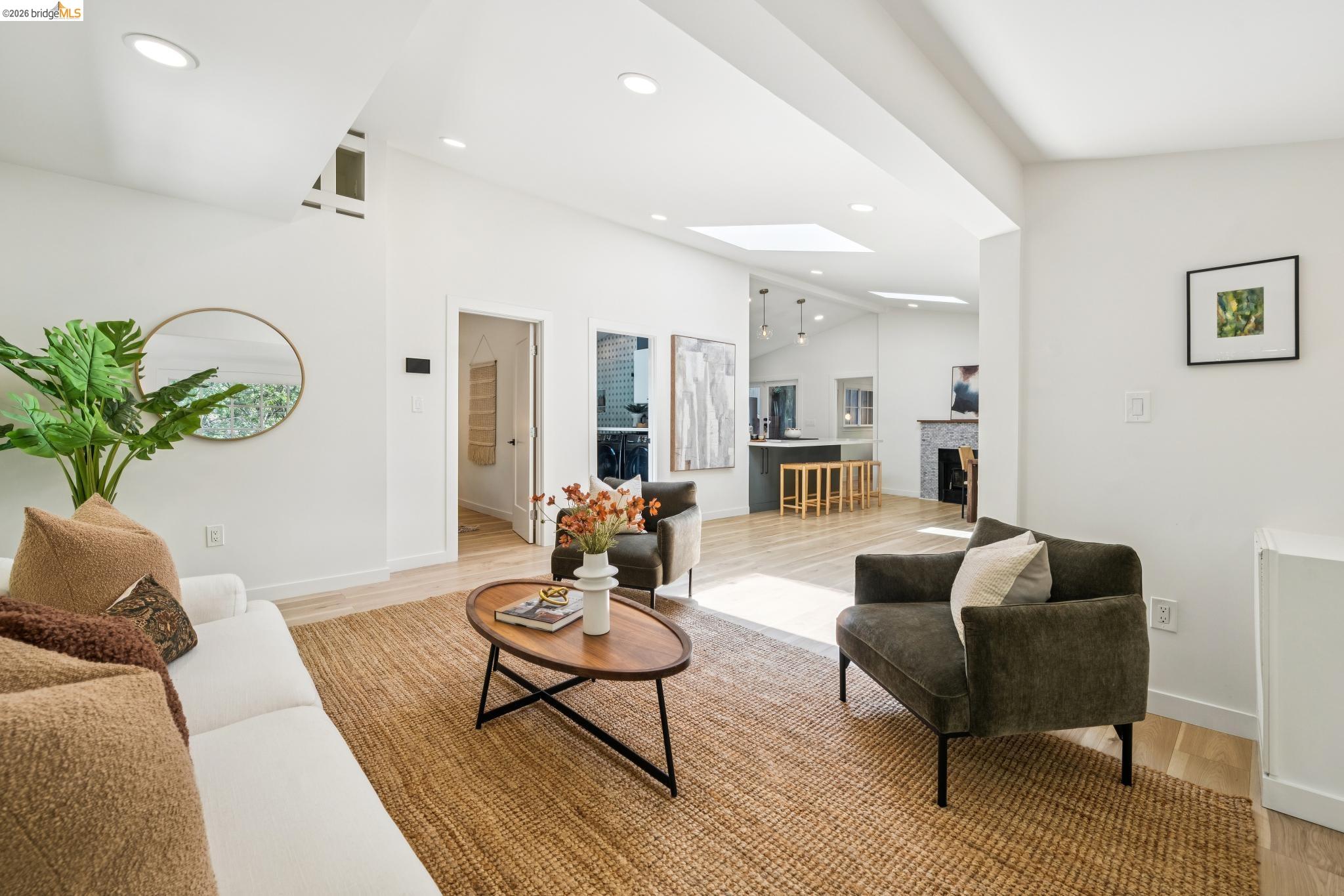 6400 Pinehaven Road Oakland, CA 94611 - Photo 10 of 78 Bright living area with recessed lighting, wood-finish flooring, and a skylight