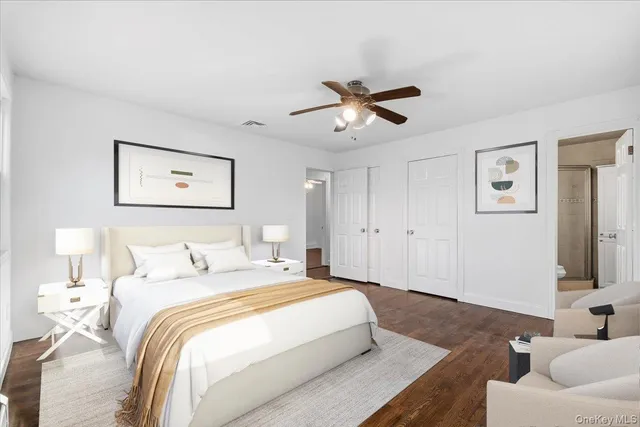 a spacious bedroom with a bed and furniture