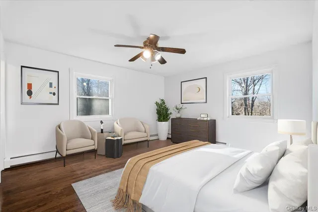 a bedroom with a large bed and a couch