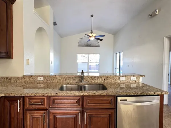 a kitchen with a counter space and a sink