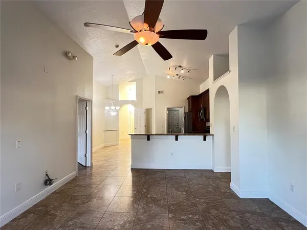 a view of a living room with a ceiling fan