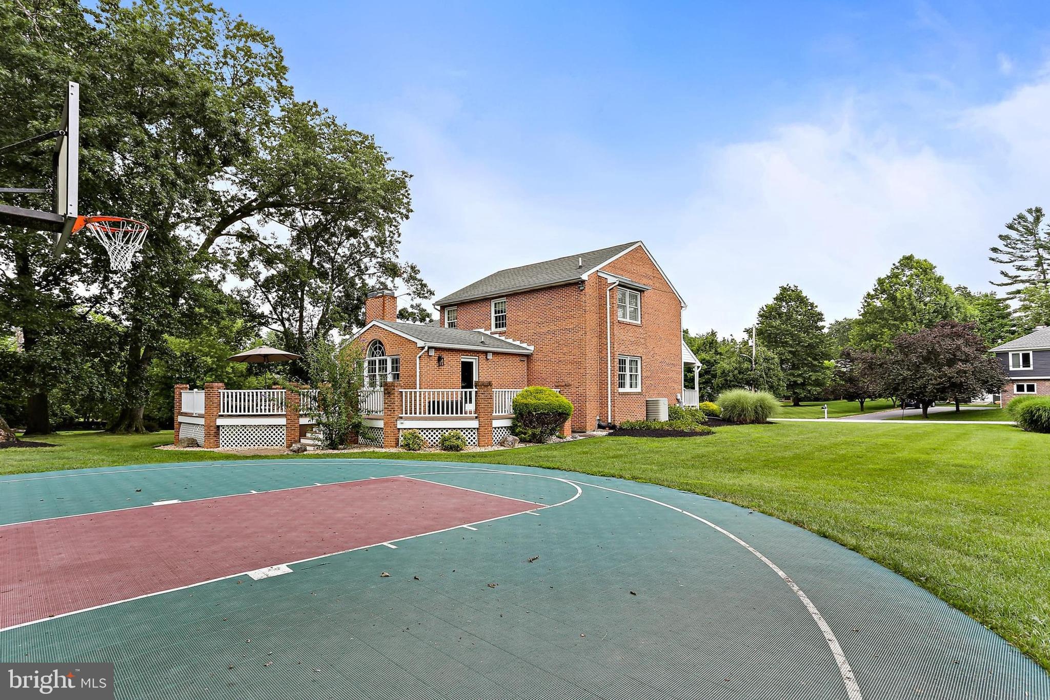 2111 Stonewall Road Baltimore, MD 21228 - Photo 54 of 58 a front view of a house with a yard and trees