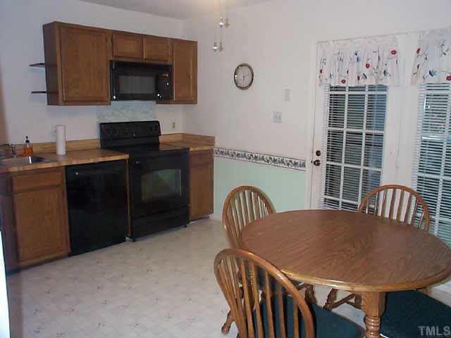 728 Red Forest Trail Raleigh, NC 27615 - Photo 5 of 8 Eat-in-kitchen has brand new stove, dishwasher, and disposal. Newer microwave. Refrigerator conveys. Other