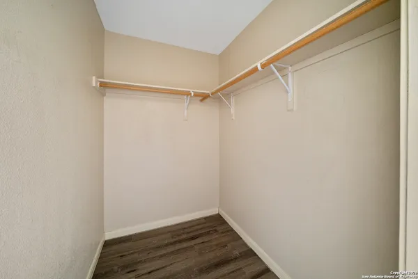 a view of an empty walk in closet