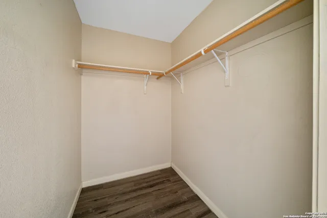 a view of an empty walk in closet