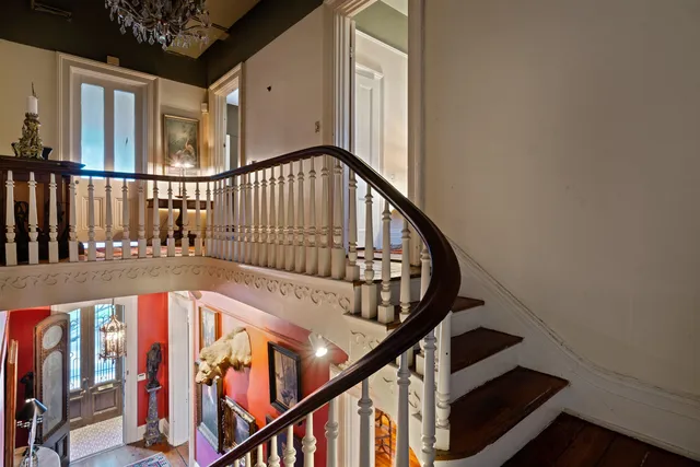 a view of an entryway with wooden floor