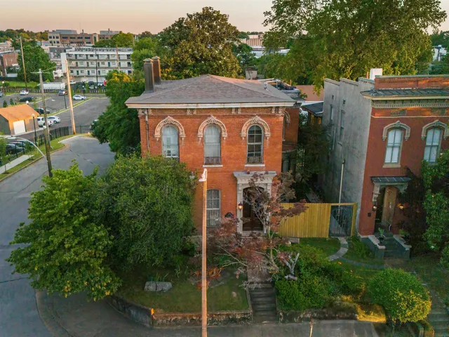 a aerial view of a house with yard and plants