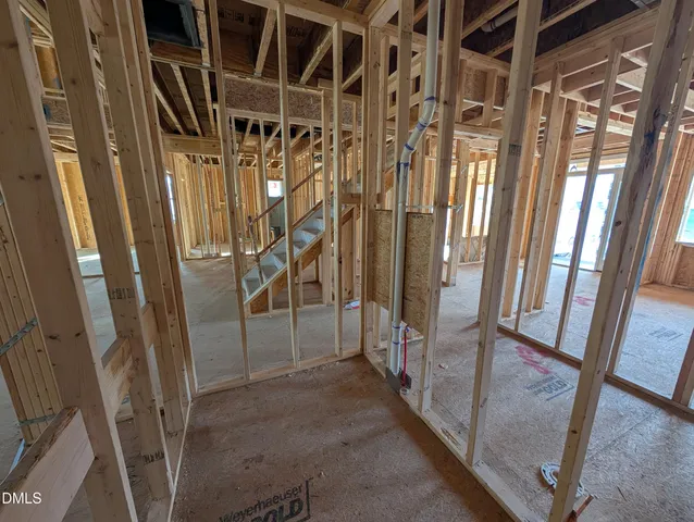a view of an empty room with wooden walls