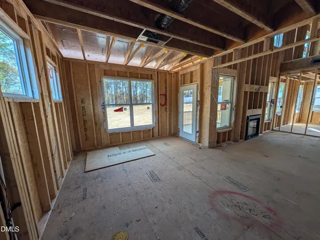 a view of an empty room with stairs