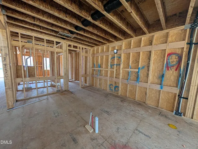 a view of a big house with a big yard and large trees