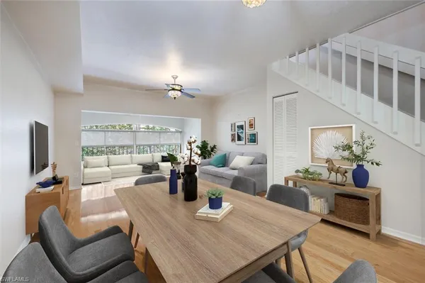 a view of a dining room with furniture window and wooden floor