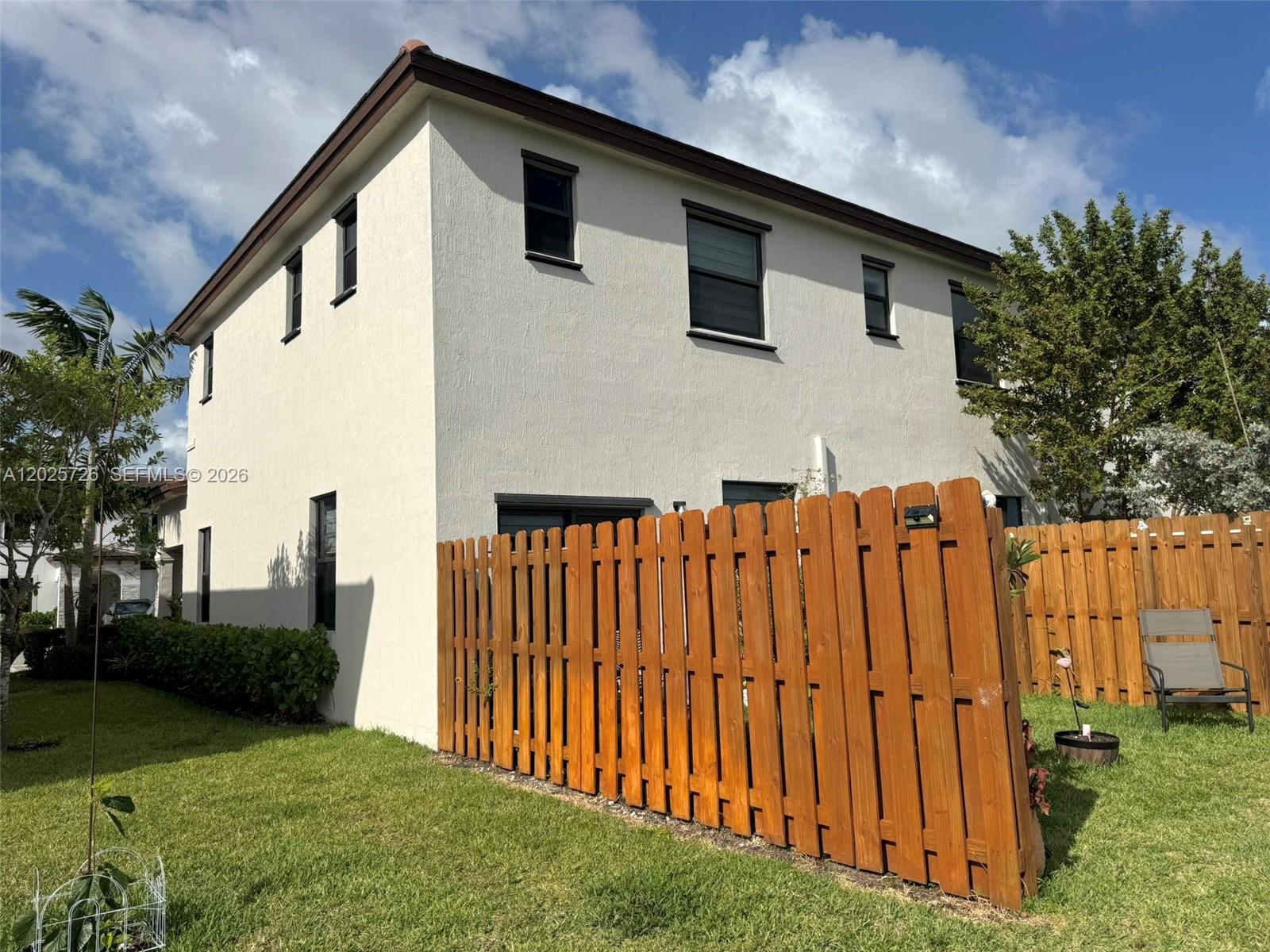 10020 Southwest 228th Terrace Miami, FL 33190 - Photo 2 of 22 a backyard of a house with lots of green space