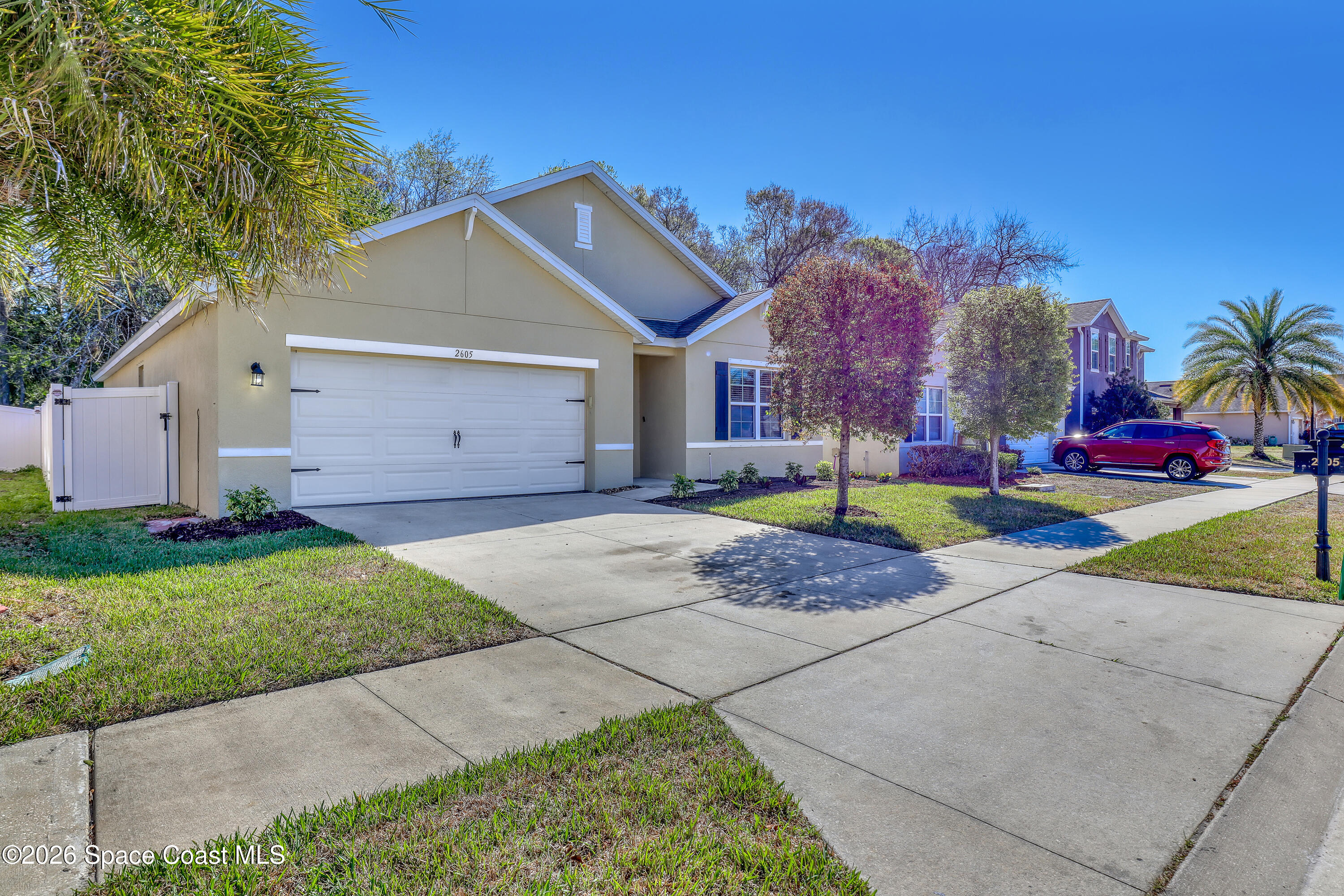 2605 Falcon Lane Mims, FL 32754 - Photo 1 of 29 a front view of house with yard and green space